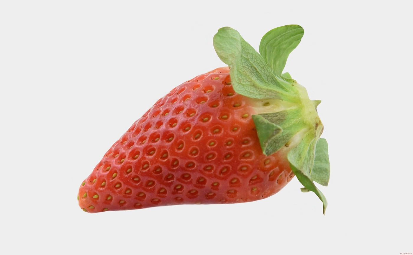 A ripe strawberry on a white background