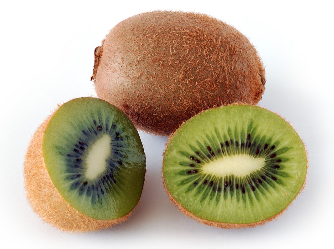 A sliced kiwi fruit showing green flesh and black seeds